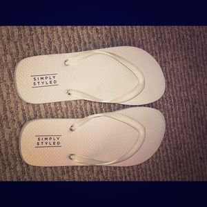 Brand new white flip flops